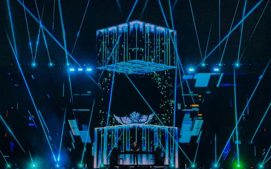 Blue and green laser beams surrounding the Monolith video structure